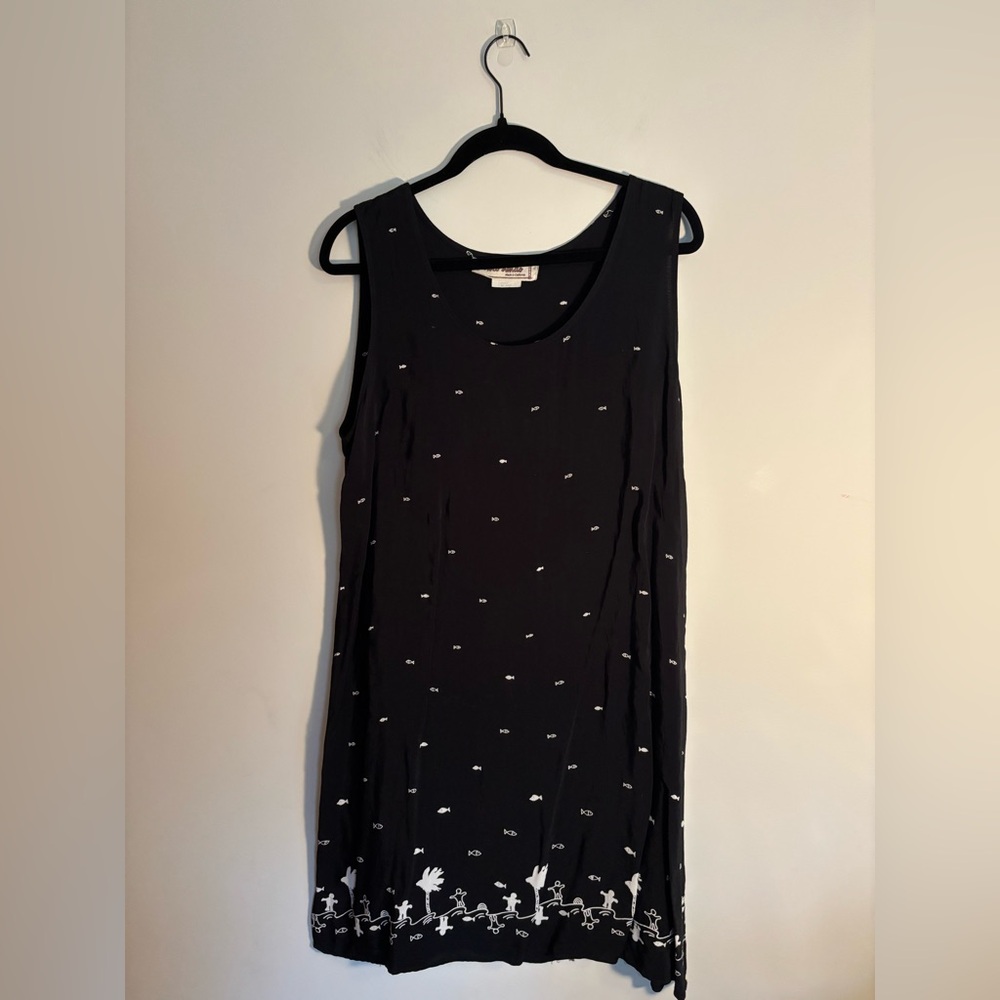 Loco Lindo black sleeveless shift with white fish and decorative bottom print.